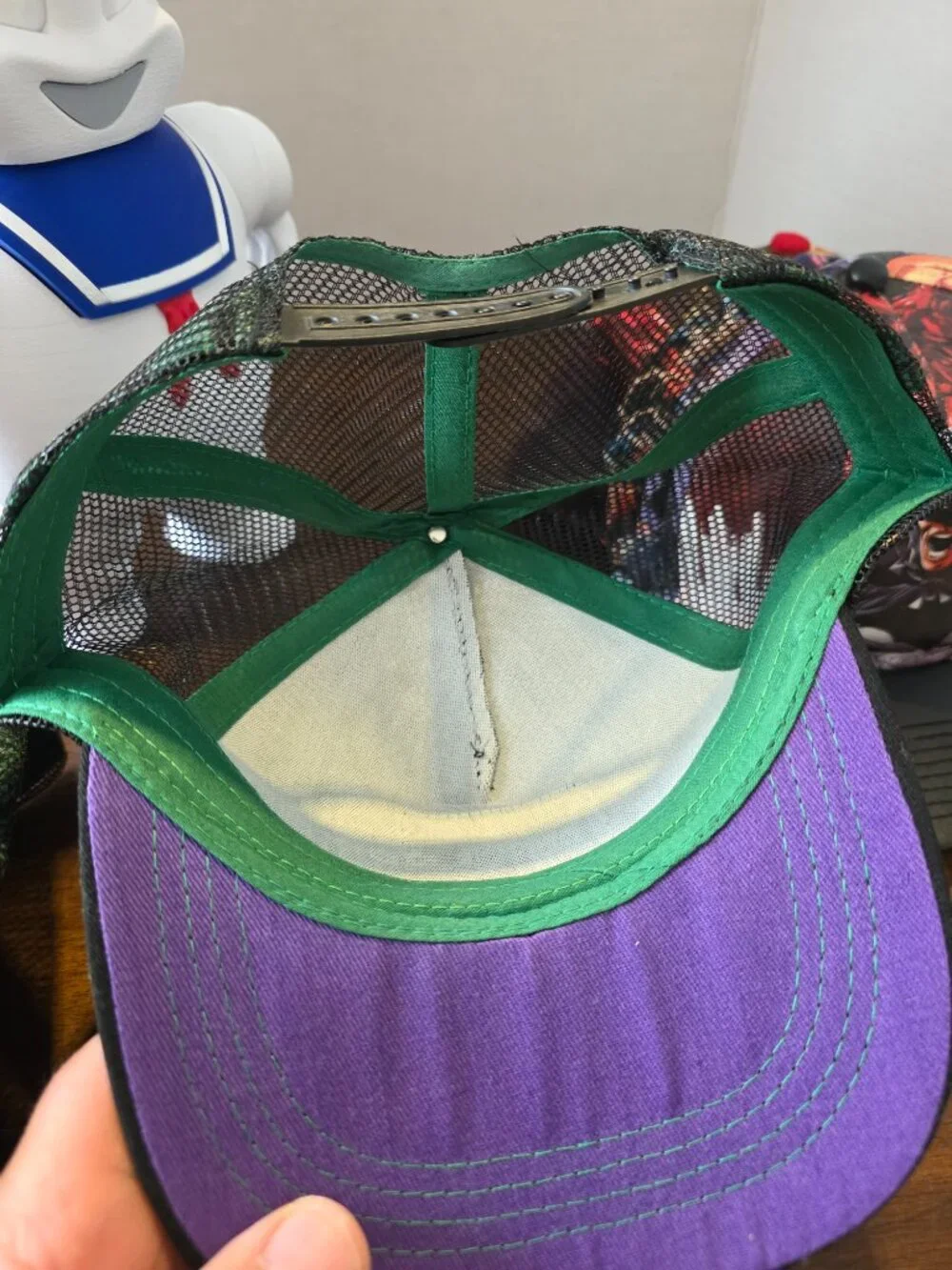 Marvel Comics snapback cap features a black mesh back